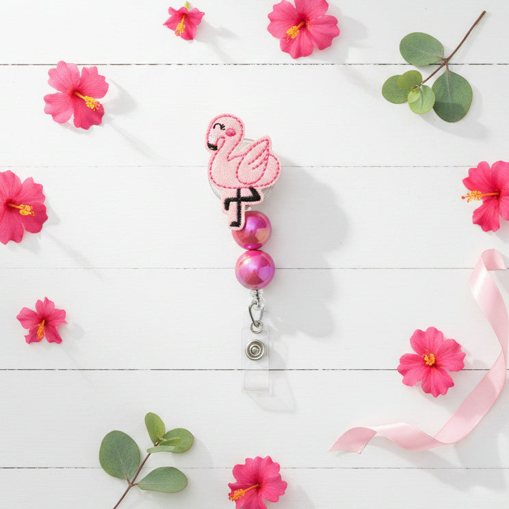 Flamingo-shaped badge holder with pink flamingo design on a white background