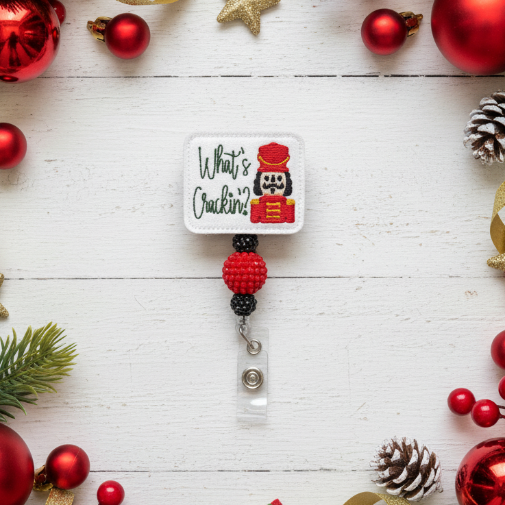 Christmas-themed badge holder with decorative ornaments on a white wooden background
