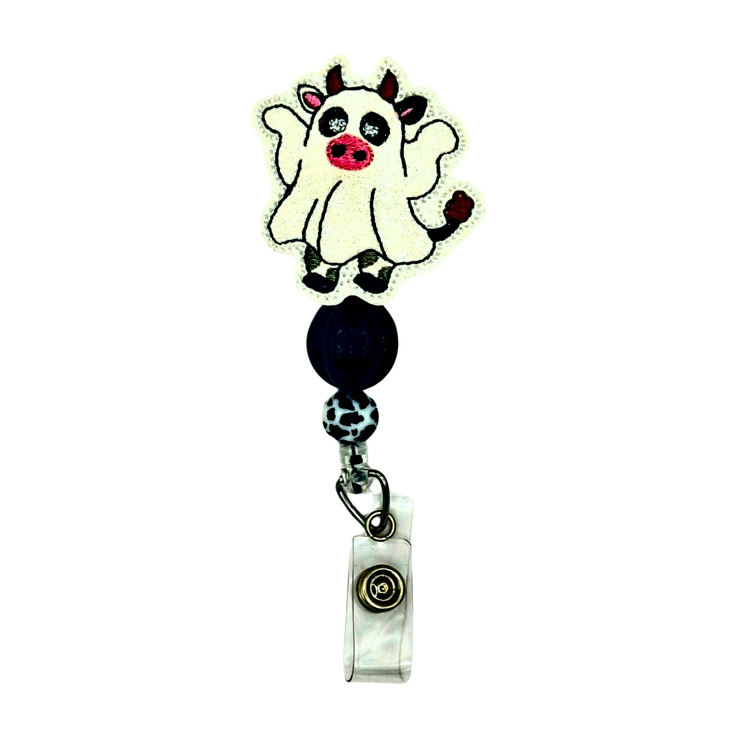 Retractable badge holder with a cow design on a white background