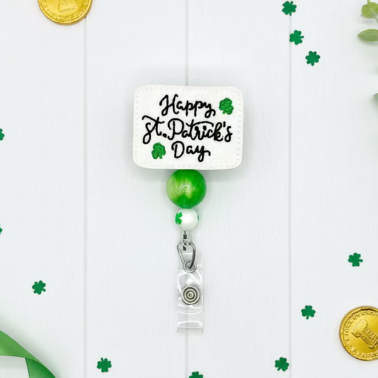 Retractable badge holder with 'Happy St. Patrick's Day' text and green accents on a white background