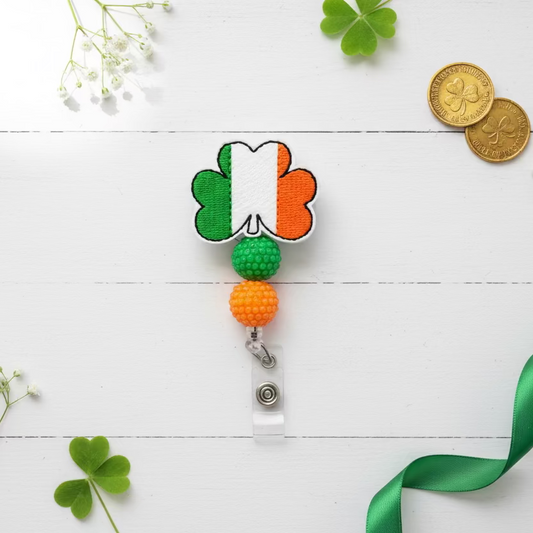 Clover-shaped badge holder with Irish flag design on a white background
