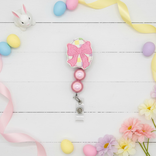 Egg with Bow Badge Reel