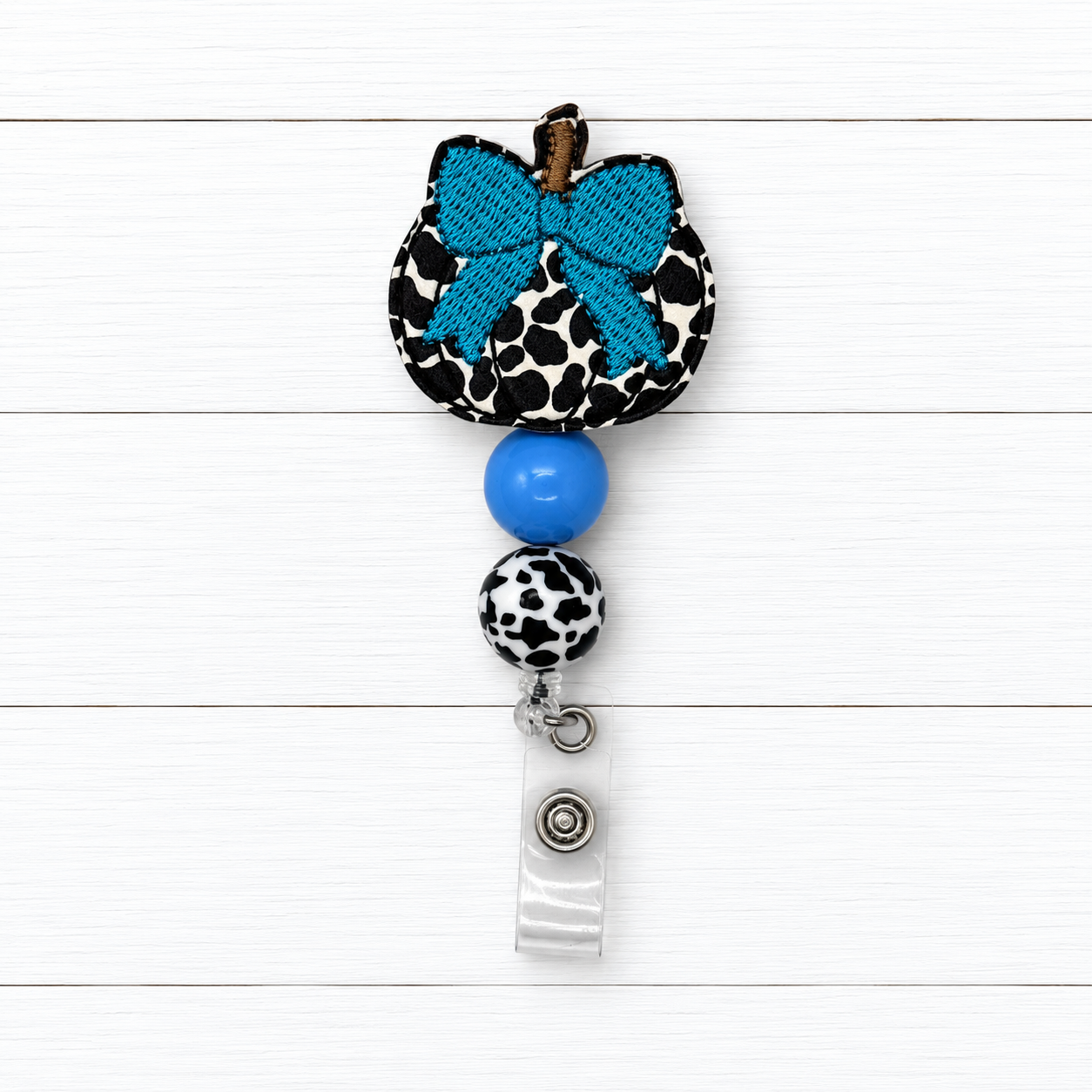 Cow Pumpkin with Bow Badge Reel