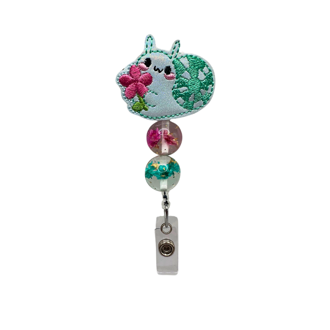 Snail with Flower Badge Reel