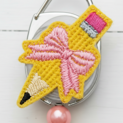 Pencil with Bow Badge Reel