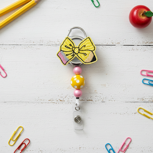 Pencil Bow Badge Reel