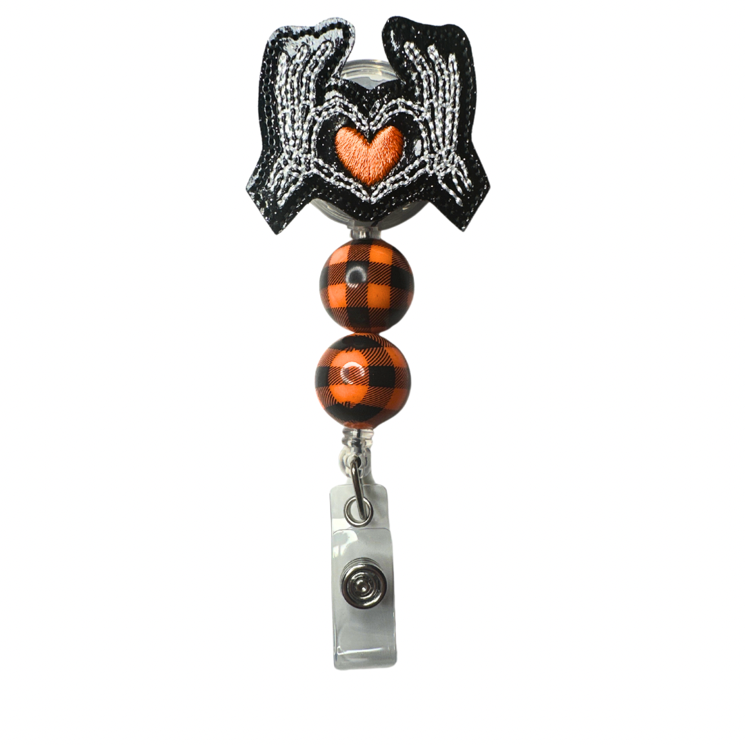 Skeleton Hand Heart Badge Reel