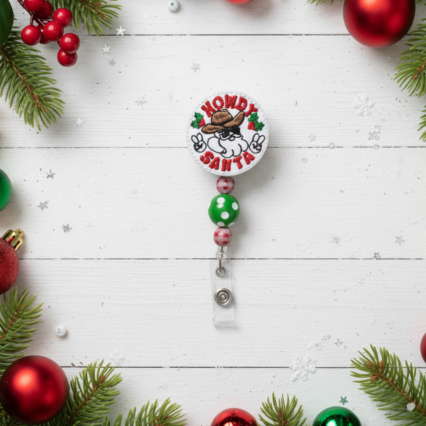 Christmas-themed badge holder with decorative elements on a white wooden background