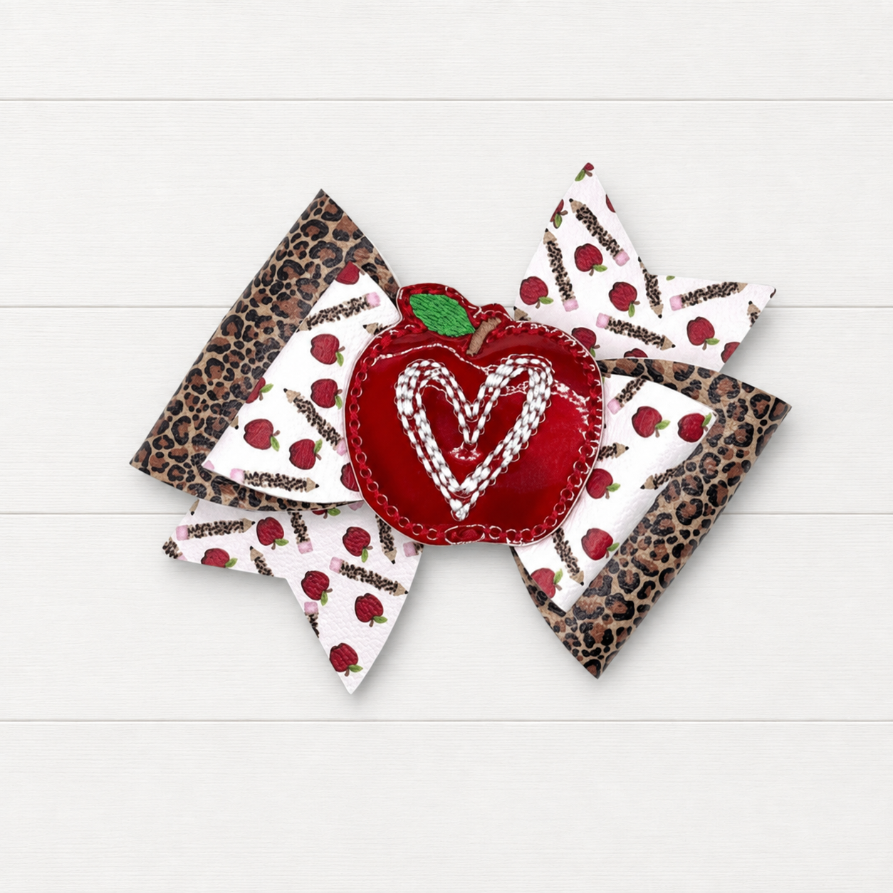 Apple Heart Hair Bow on a clean white wood background