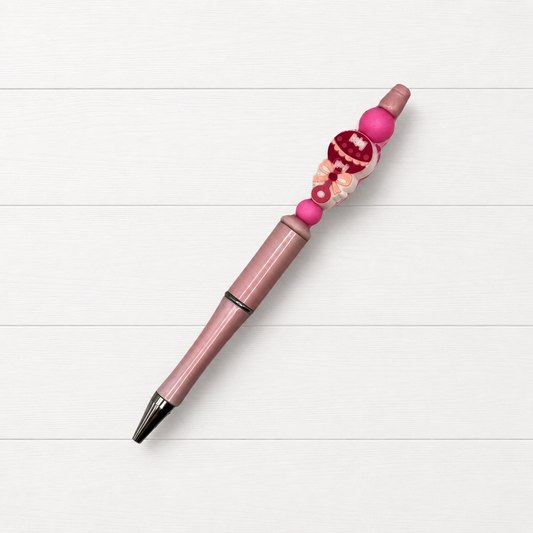 Baby Girl Beaded Pen on a clean white wood background