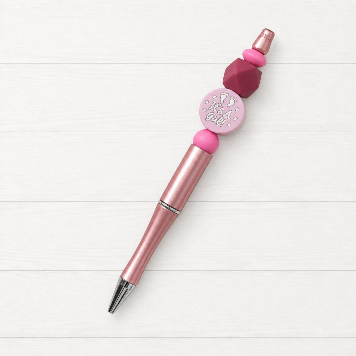 Birth Announcement Beaded Pen on a clean white wood background