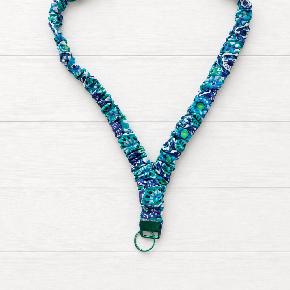 Blue Flower Power Scrunchie Lanyard on a clean white wood background