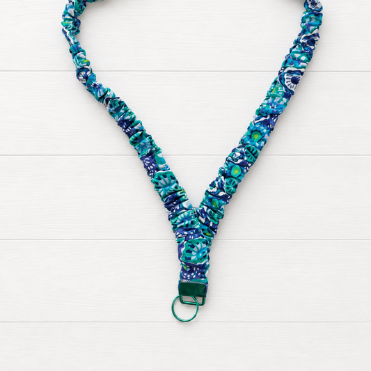 Blue Flower Power Scrunchie Lanyard on a clean white wood background