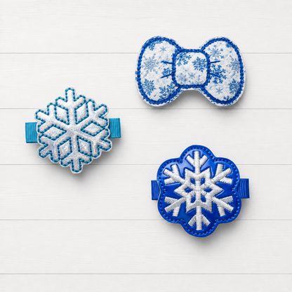 Blue Snowflake Hair Bow Clips on a clean white wood background