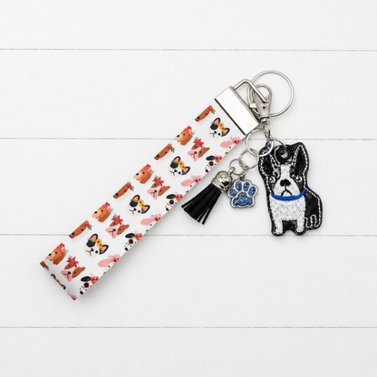 Boston Terrier Keychain and Wristlet on clean white painted wood background