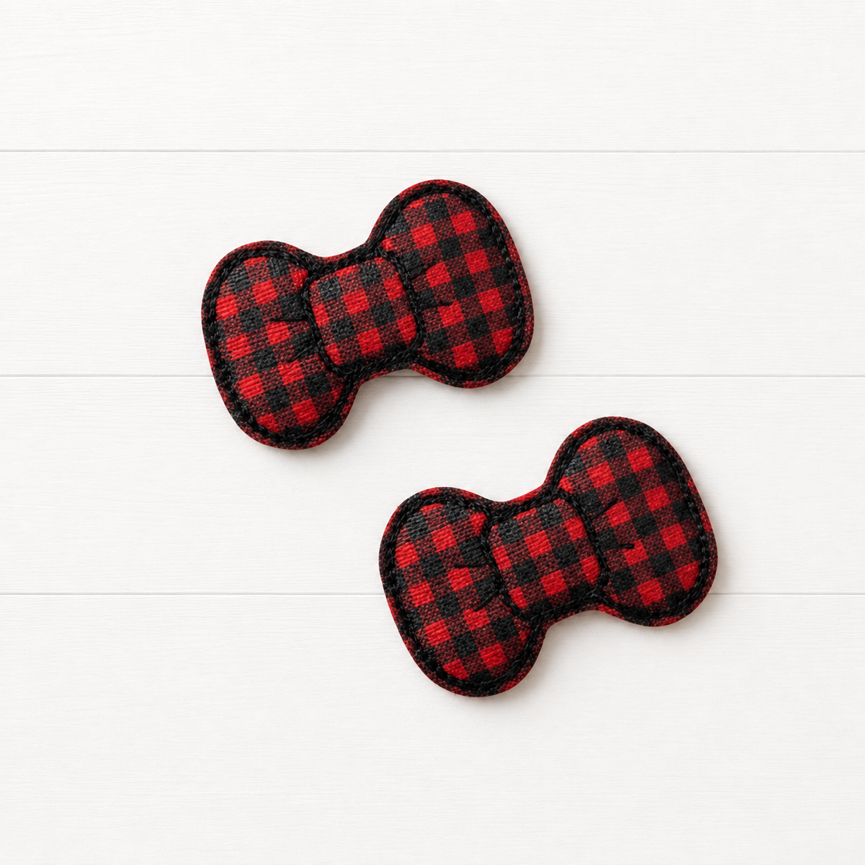 Buffalo Plaid Feltie Hair Bow Clips on a clean white wood background