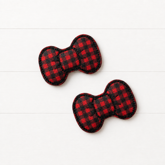 Buffalo Plaid Feltie Hair Bow Clips on a clean white wood background