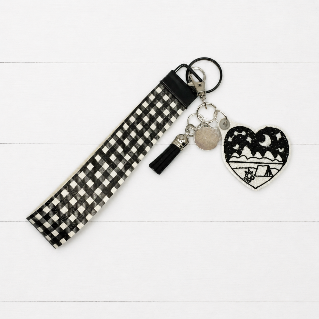 Camp Heart Keychain and Wristlet on clean white painted wood background