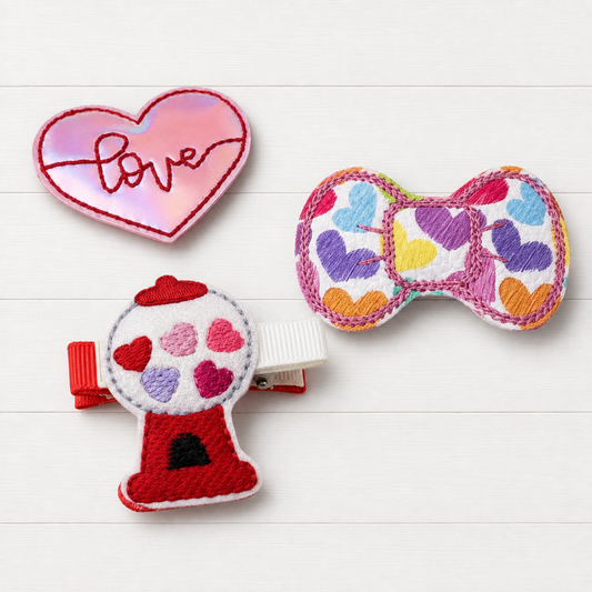 Candy Machine and Heart Hair Bow Clip Set on a clean white wood background