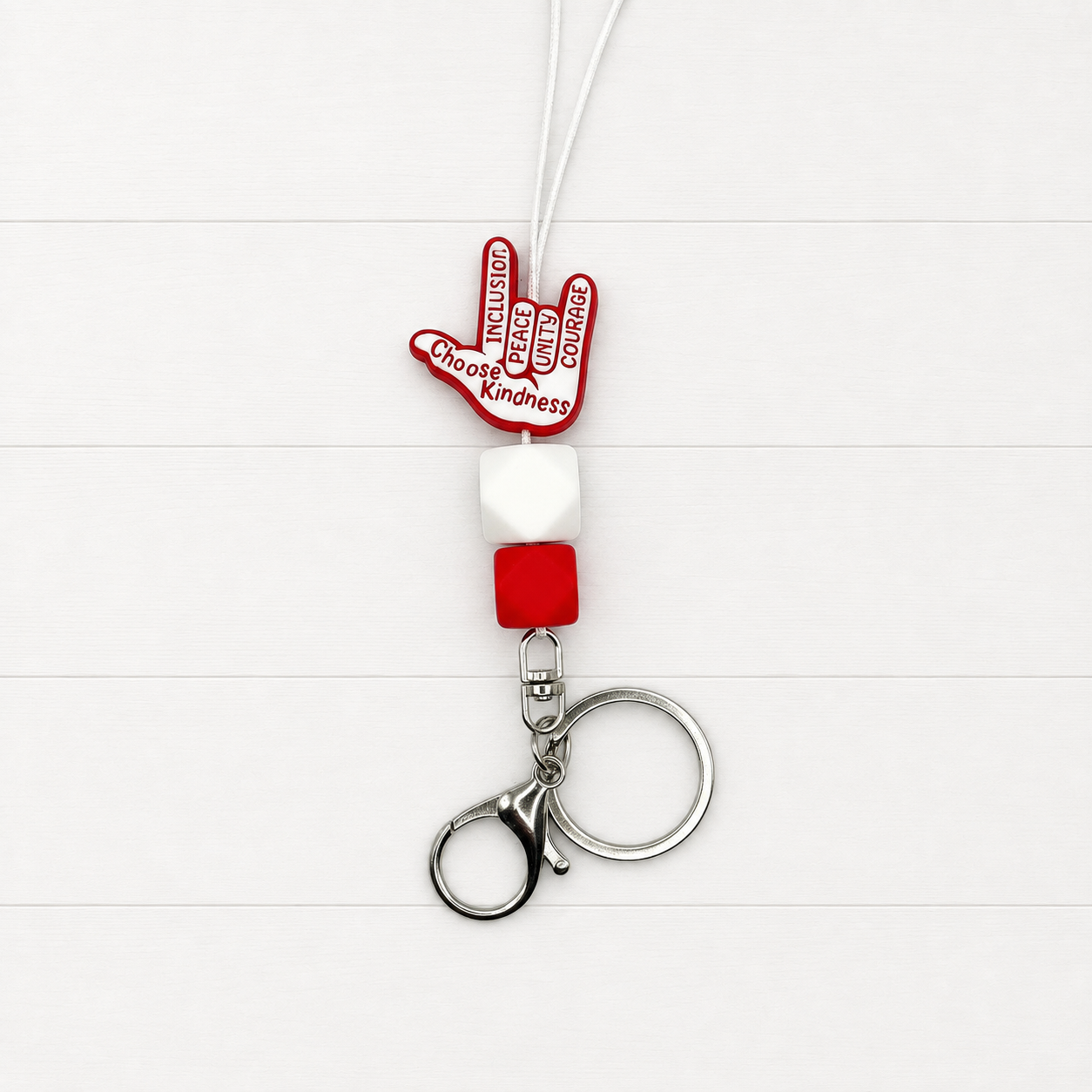 Choose Kindness Lanyard on a clean white wood background