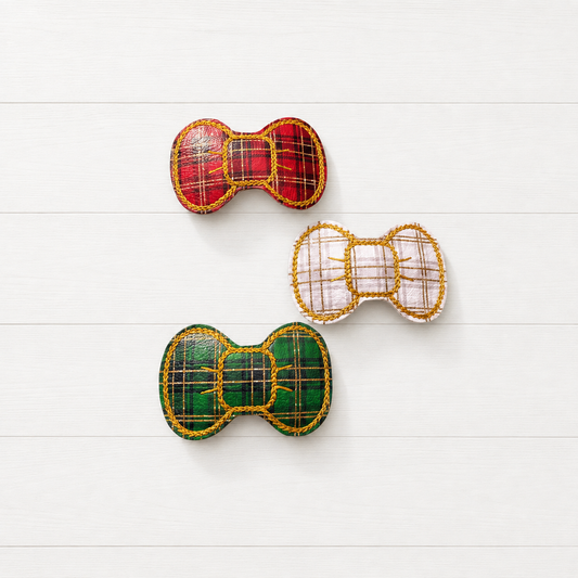 Green, Red, and White Plaid Hair Bow Clip Set on a clean white wood background