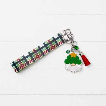 Christmas Tree Gnome Keychain and Wristlet on clean white painted wood background