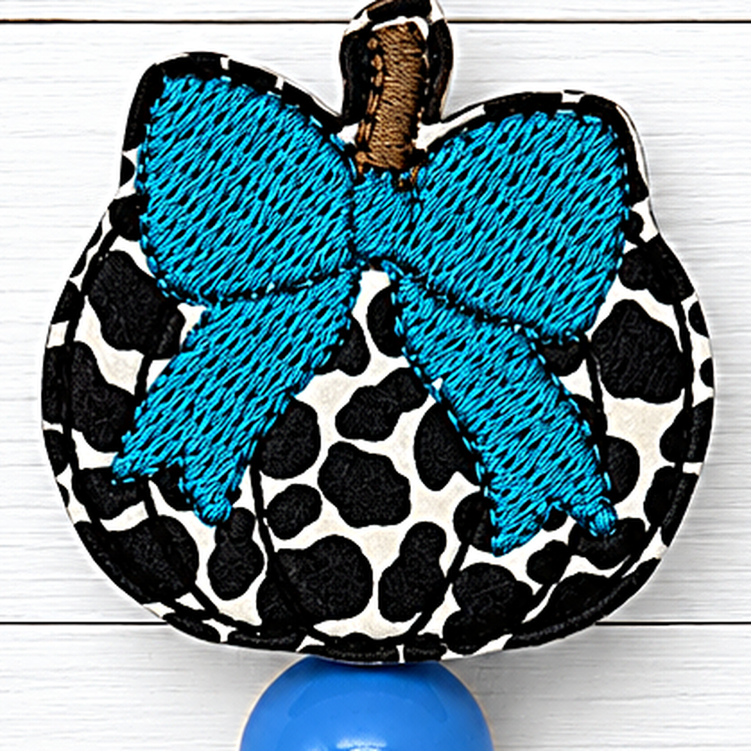 Cow Pumpkin with Bow Badge Reel