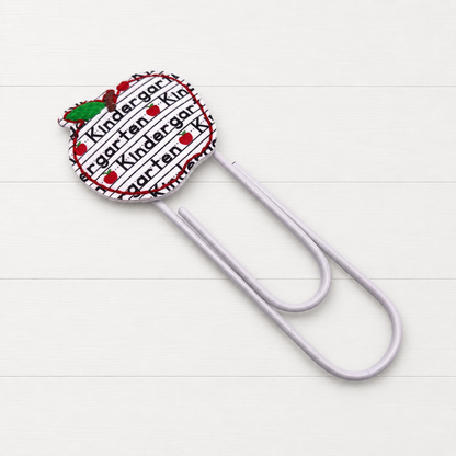 Grade Level Apple Oversized Paper Clip on a clean white wood background
