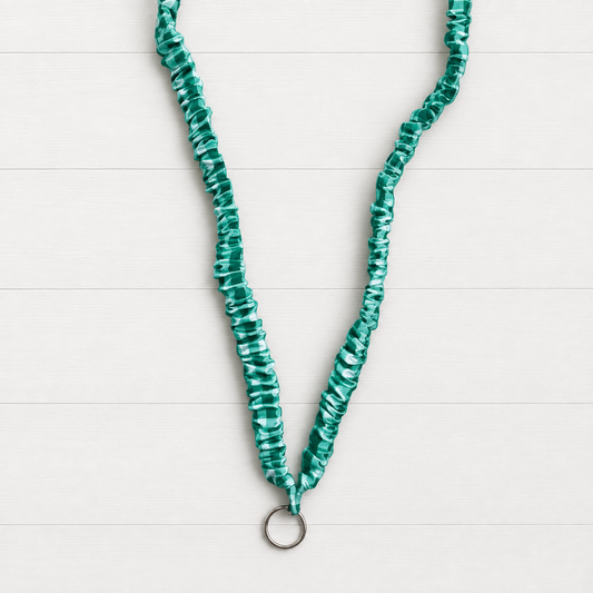 Green Gingahm Scrunchie Lanyard on a clean white wood background