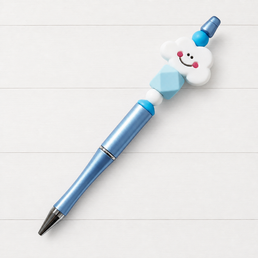 Happy Cloud Beaded Pen on a clean white wood background