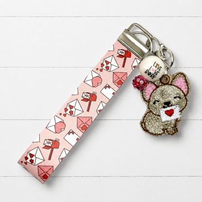 Dog with Love Letter Keychain and Wristlet — clean white wood primary image