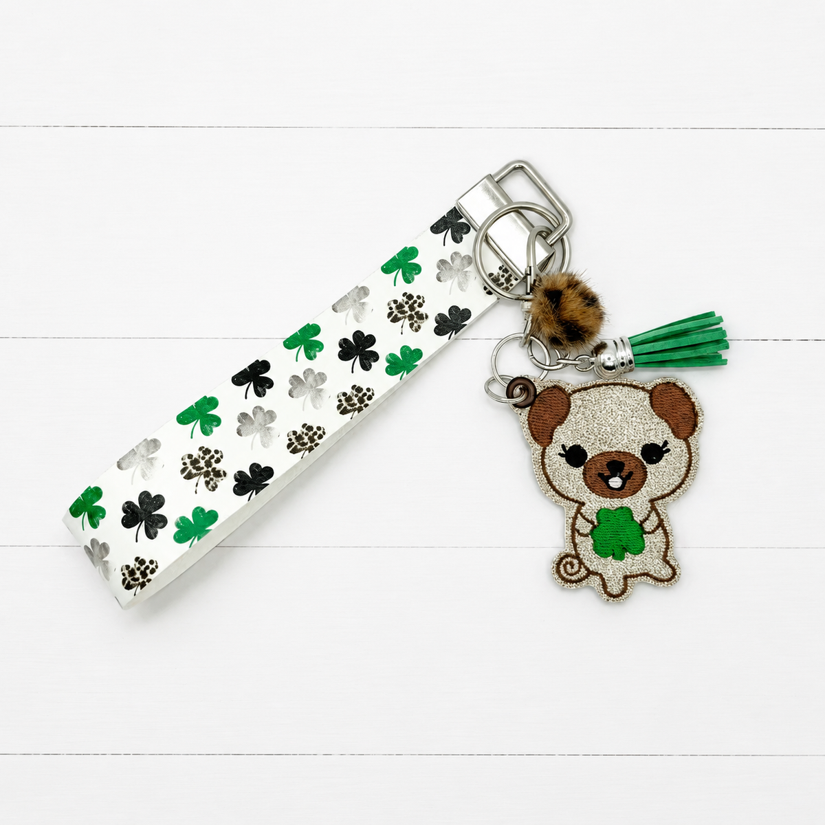 Dog with Shamrock Keychain and Wristlet — clean white wood primary image