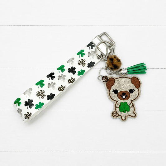 Dog with Shamrock Keychain and Wristlet — clean white wood primary image