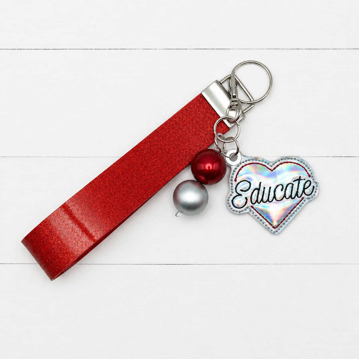 Educate Heart Keychain and Wristlet — clean white wood primary image