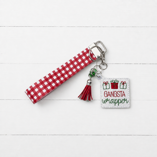 Gangsta Wrapper Keychain and Wristlet — clean white wood primary image