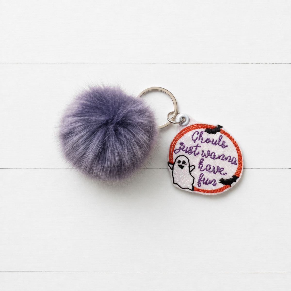 Ghouls Just Wanna Have Fun Pom Pom Keychain — clean white wood primary image