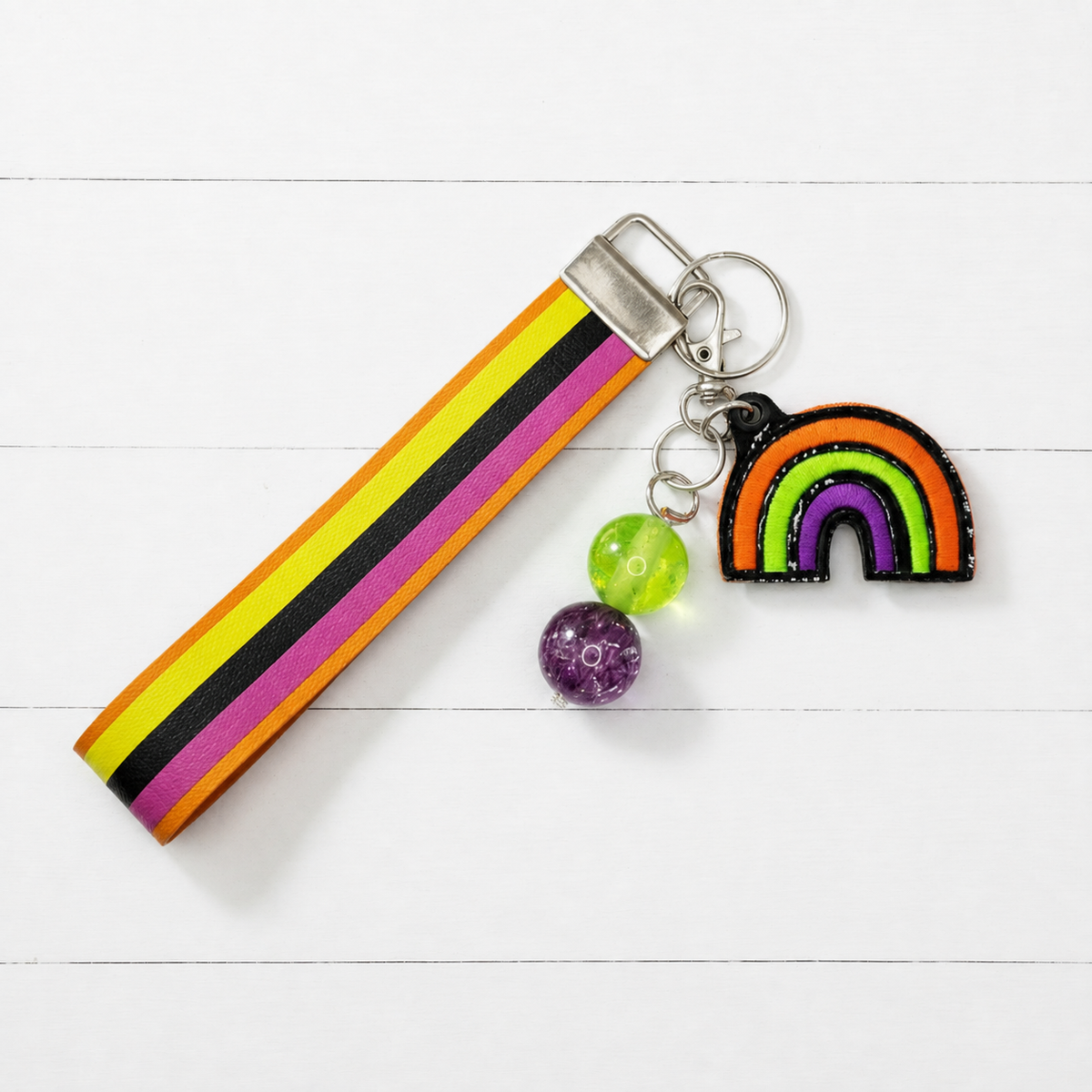 Halloween Rainbow Keychain and wristlet — clean white wood primary image