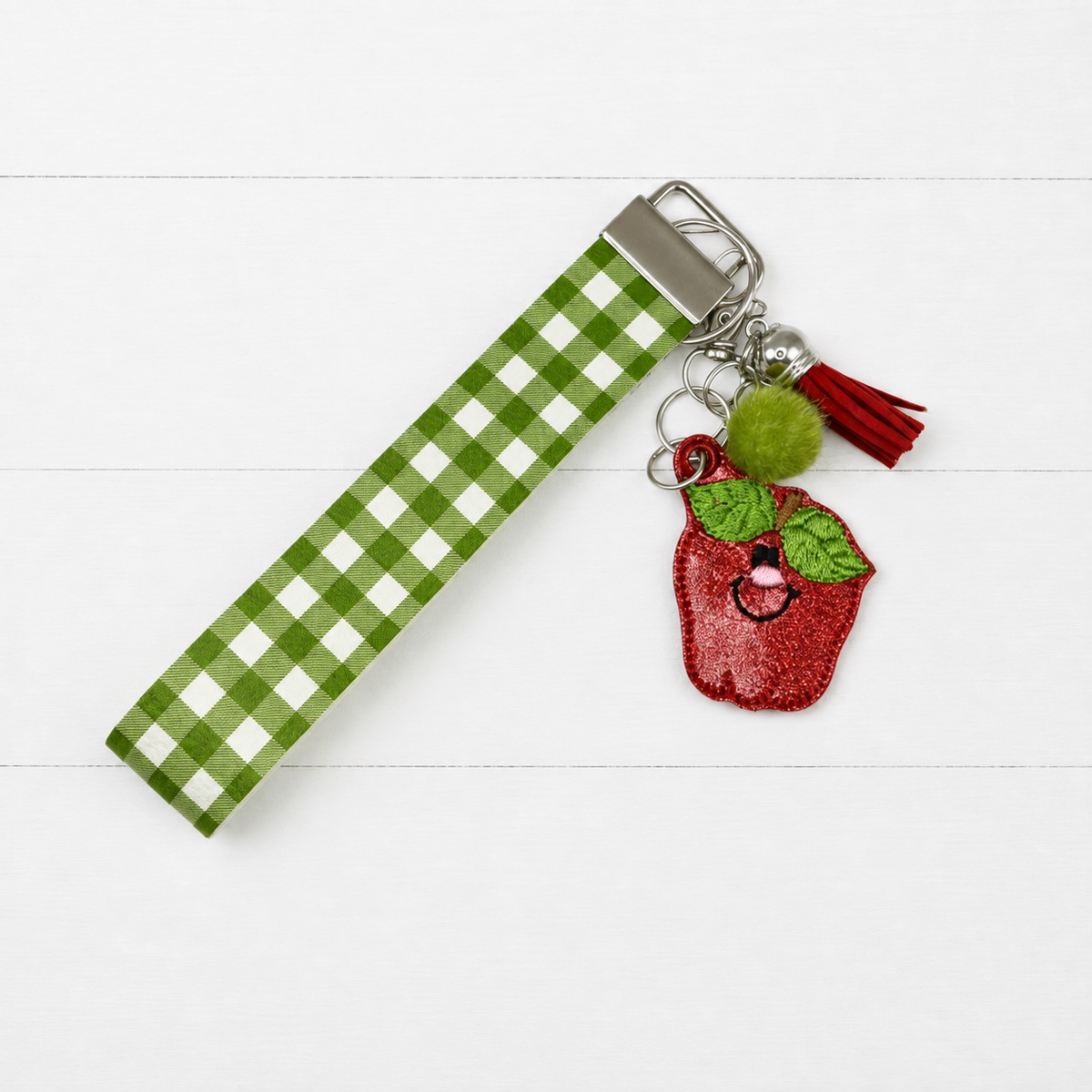 Happy Apple Keychain and Wristlet — clean white wood primary image