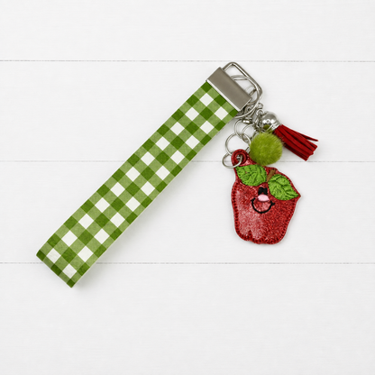 Happy Apple Keychain and Wristlet — clean white wood primary image