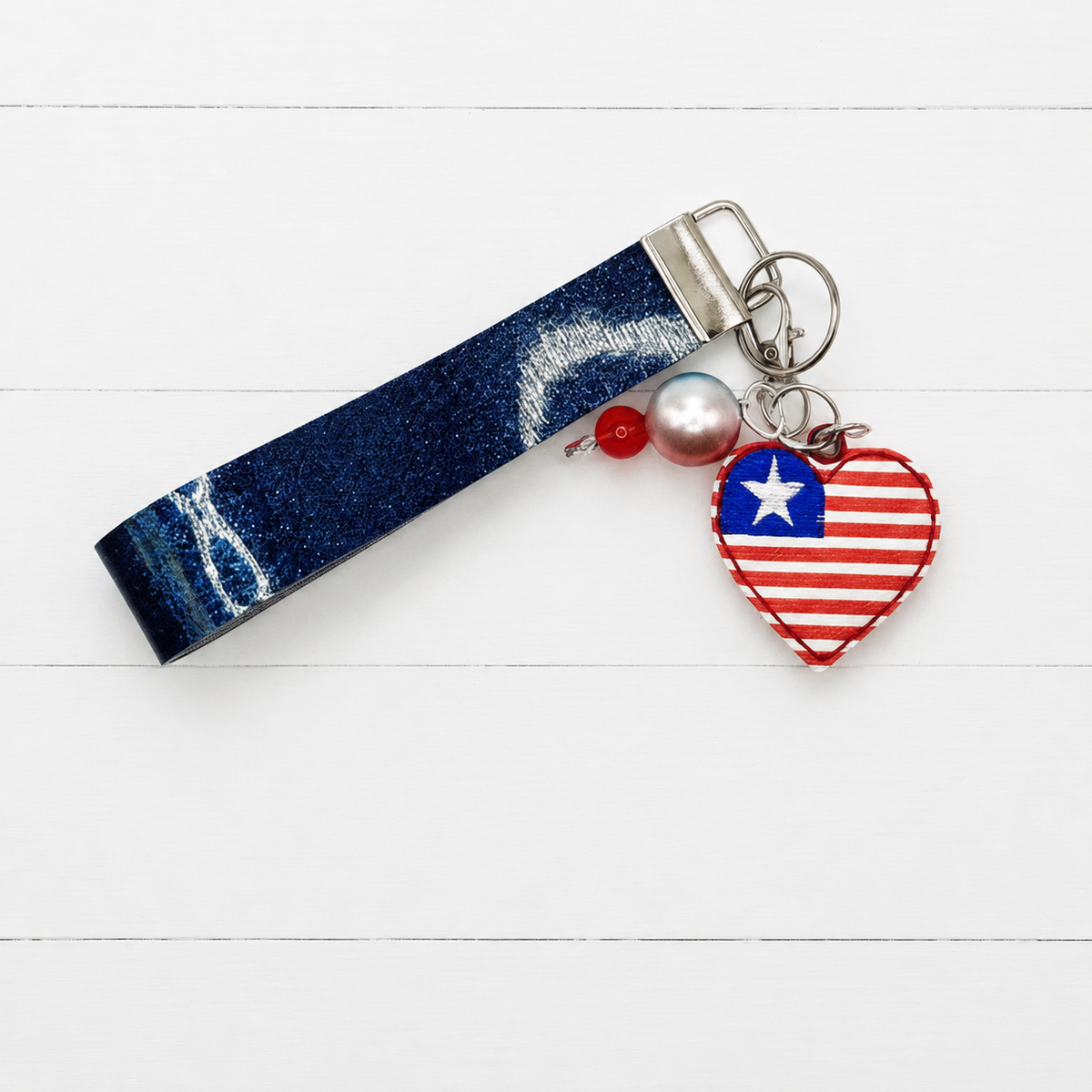 Heart Flag Keychain and Wristlet — clean white wood primary image