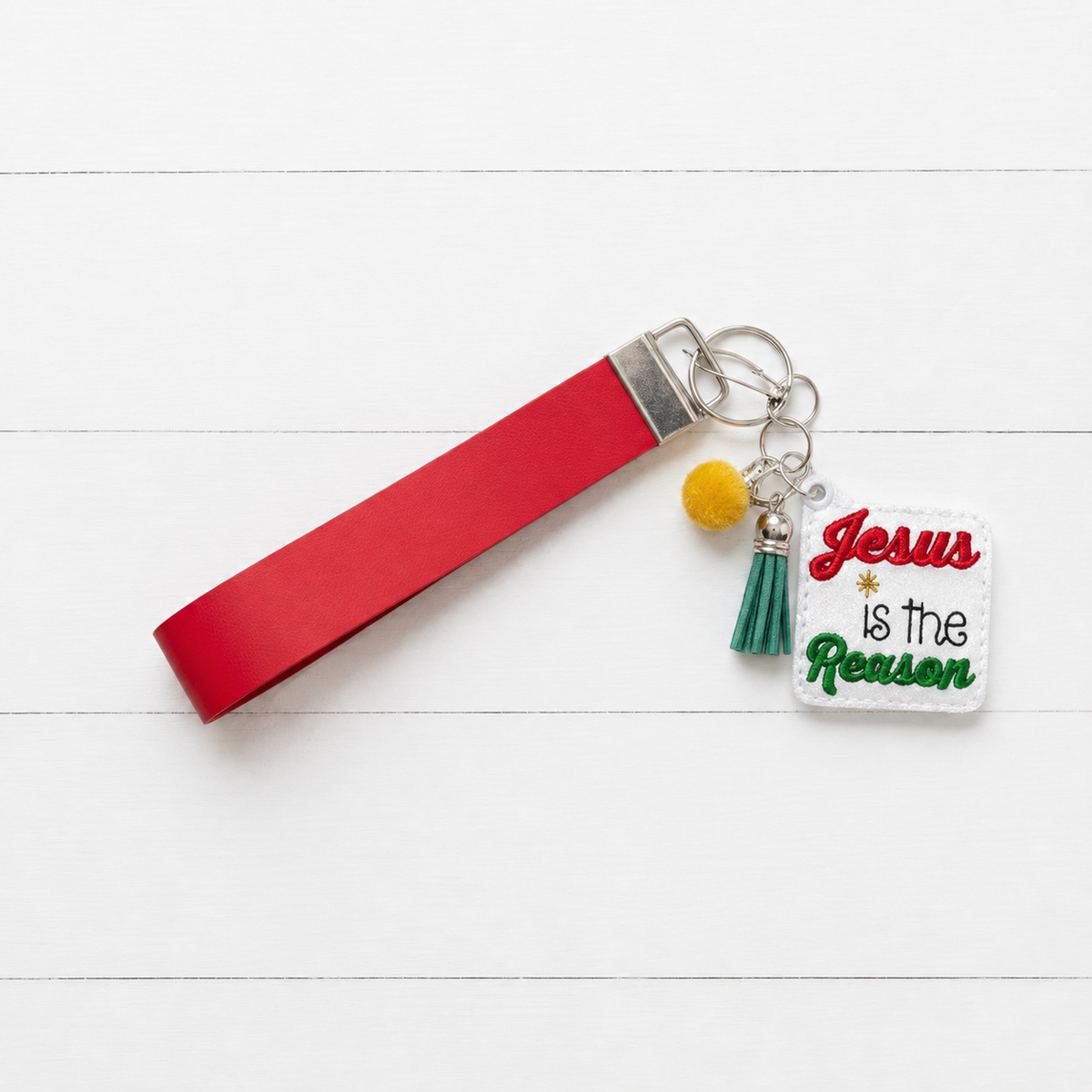 Jesus is the Reason Keychain and Wristlet — clean white wood primary image