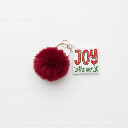 Joy to the World Pom Pom Keychain — clean white wood primary image