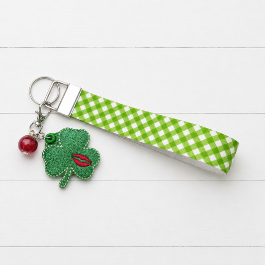 Kiss Shamrock Keychain and Wristlet — clean white wood primary image