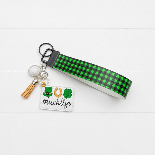 Luck Life Keychain and Wristlet — clean white wood primary image