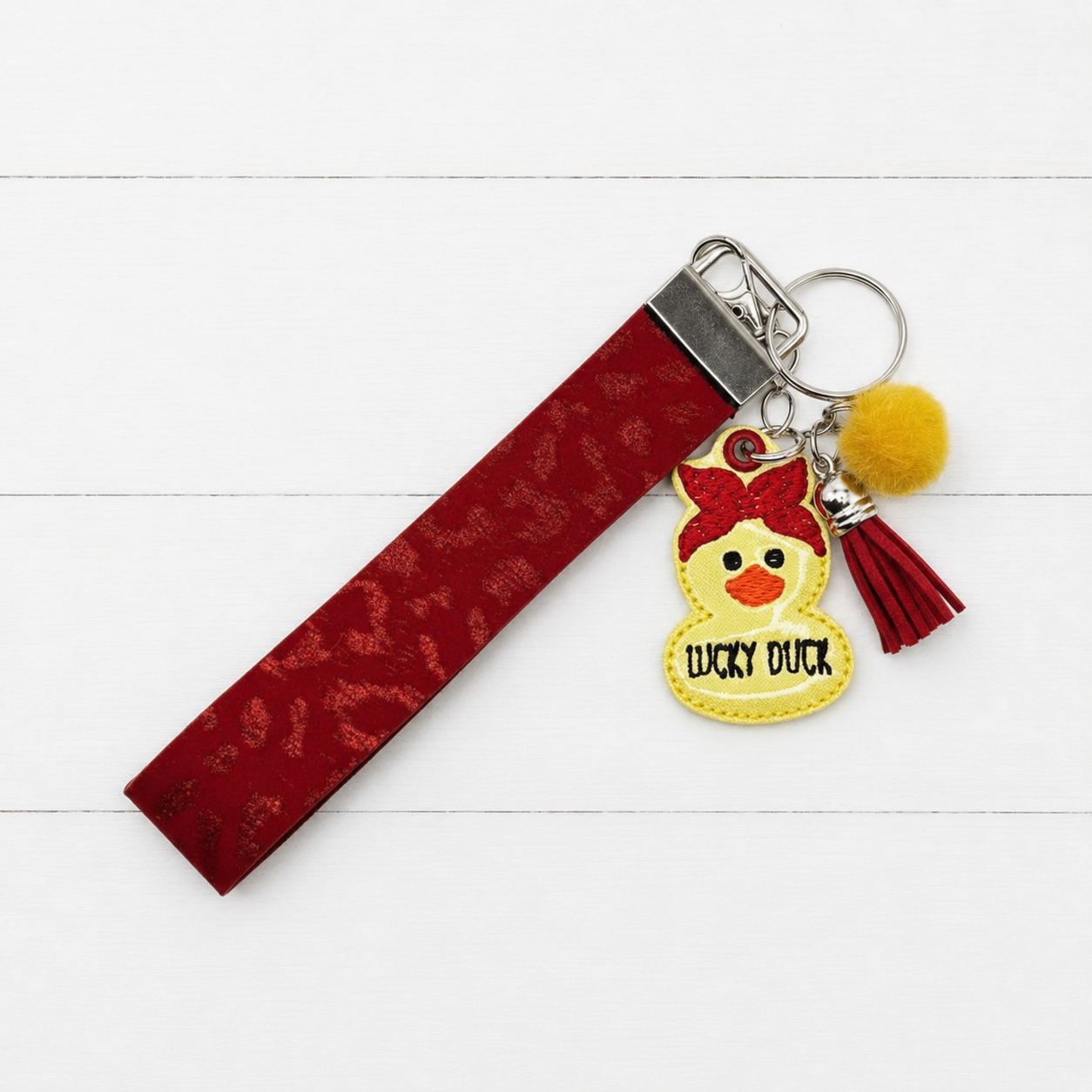 Lucky Duck Keychain and Wristlet — clean white wood primary image