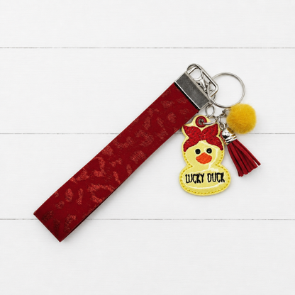 Lucky Duck Keychain and Wristlet — clean white wood primary image