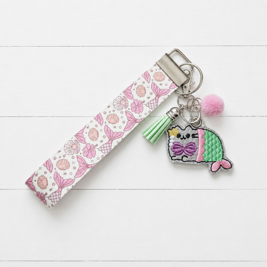 Meowmaid Keychain and Wristlet — clean white wood primary image