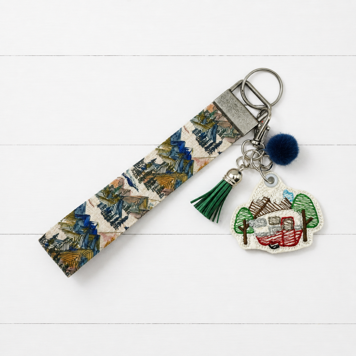 Mountain Camper Keychain and Wristlet — clean white wood primary image