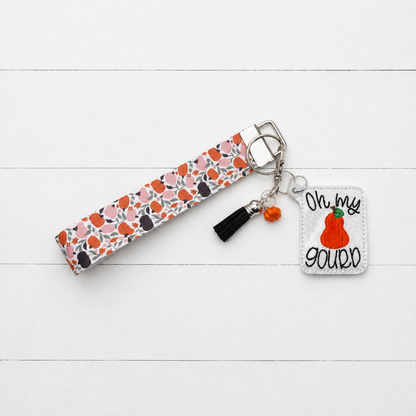 Oh My Gourd Keychain and Wristlet — clean white wood primary image