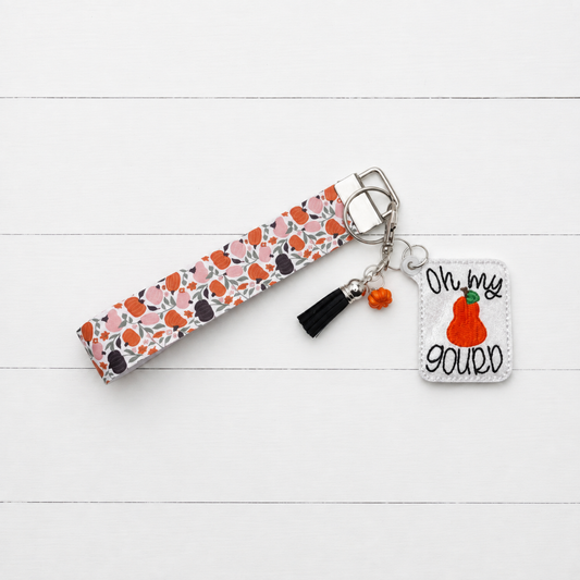 Oh My Gourd Keychain and Wristlet — clean white wood primary image